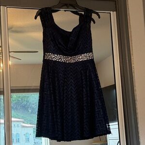 Elegant Navy Sleeveless Dress with Embellished Waist